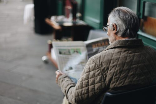 man reading newspaper