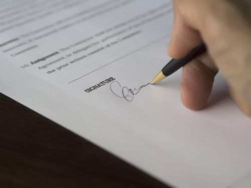 signing contract paperwork - Butler County Trust Attorneys Concept image