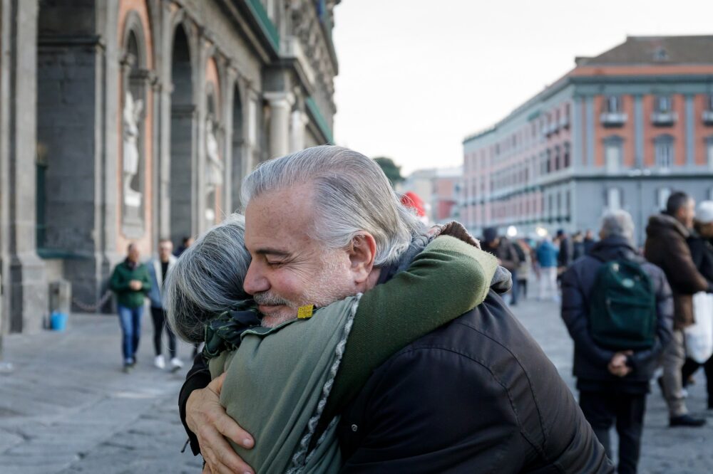 elder couple hugging
