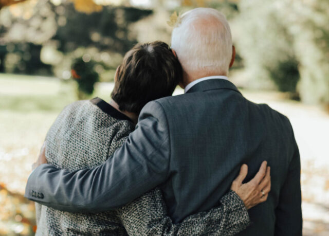elder couple hugging