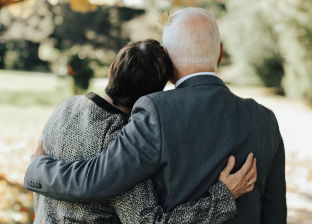 elder couple hugging