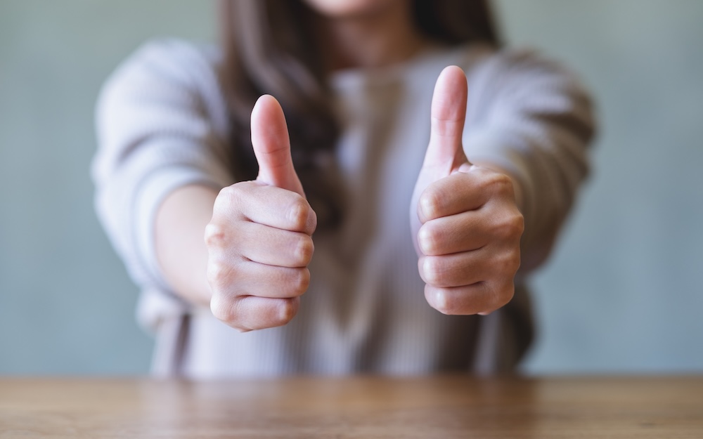 thumbs up woman